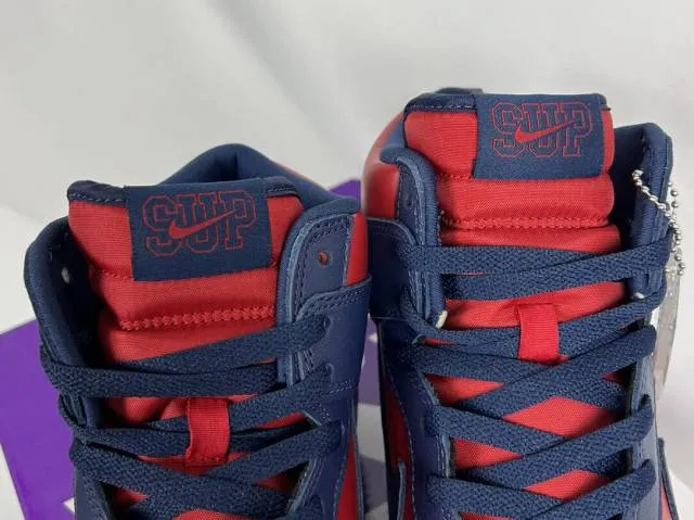 Supreme x nike sb dunk high by any means varsity red